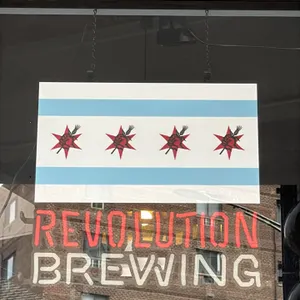 Revolution Brewing illuminated window sign. Features Chicago flag motif panel with Revolution Brewing red star logos, illuminated red 'REVOLUTION' let