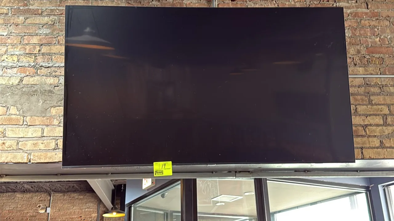 Samsung 74" flat-screen television. Wall mounted.