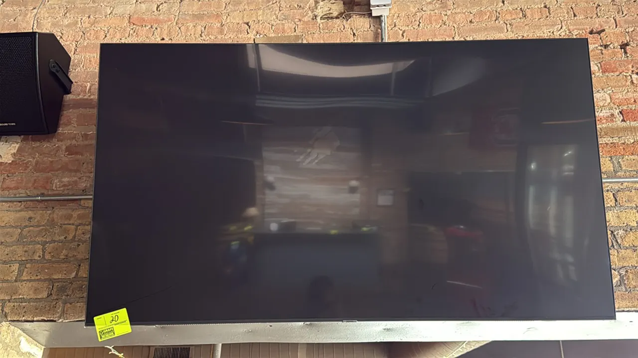Samsung 74" flat-screen television. Wall mounted. Speaker not included.