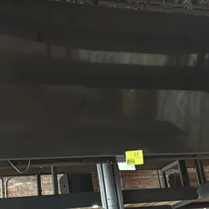 Samsung 65" flat-screen television. Features a slim bezel design. Wall mounted. Remote not included.
