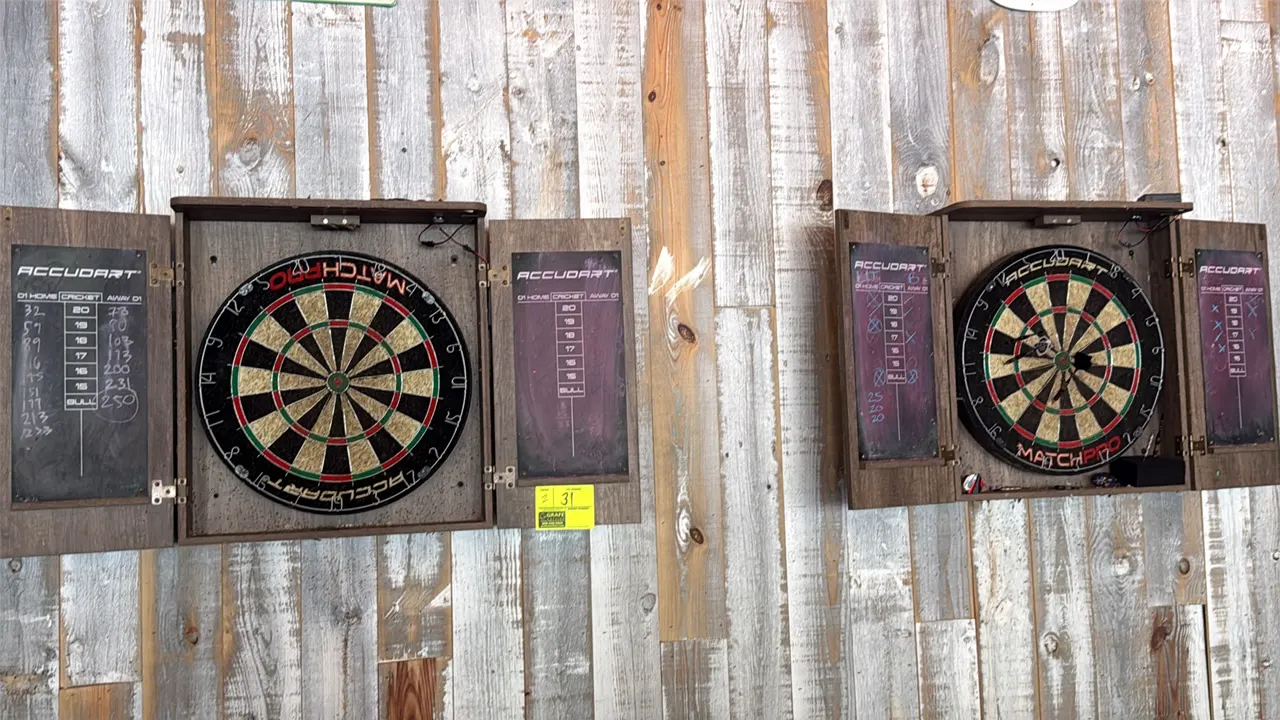 Accudart Match Pro wood dartboard cabinets with dartboards. Features dual hinged doors with integrated cricket scoreboards, sisal dartboards, and over