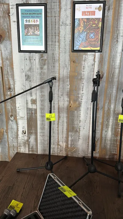 Rok-It tripod microphone boom stands. Features adjustable height with twist clutch mechanism, adjustable boom arm, and collapsible tripod base. Black