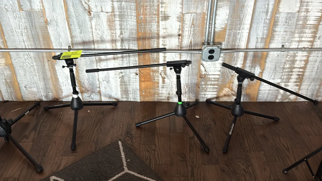 JamStands low-profile boom microphone stands. Features adjustable boom arms and collapsible tripod bases with non-slip rubber feet. Finished in black.