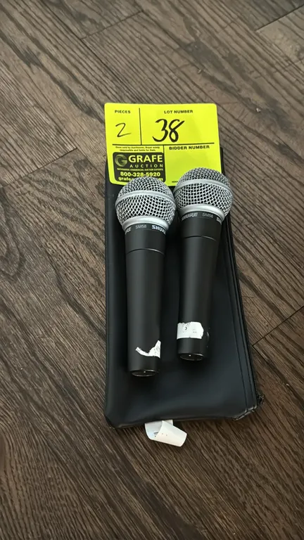 Shure SM58 dynamic vocal microphones. Features spherical mesh grilles and 3-pin XLR connections. Includes zippered storage pouch.