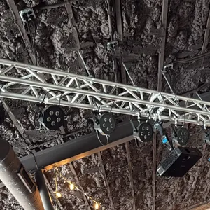 Aluminum box lighting truss with (12) LED PAR can lights. Features modular aluminum truss construction with clamp-mounted stage lights. Approximately 