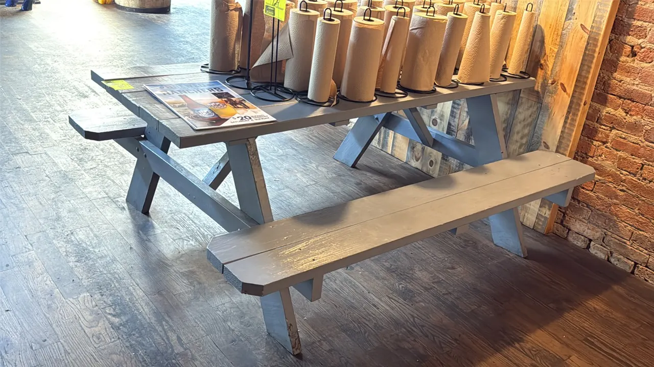 Painted wood picnic table. Features gray painted finish and attached bench seating. 71"L. Contents not included.