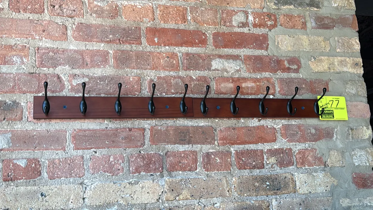 Wood coat racks. Features dark finish wood bases and black metal hooks. 17"L. Wall-mounted.