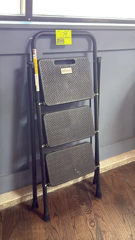 HBTower 3-step folding step ladder. Features textured anti-slip steps, built-in carry handle cutout on top step, tubular metal frame, and non-slip fee