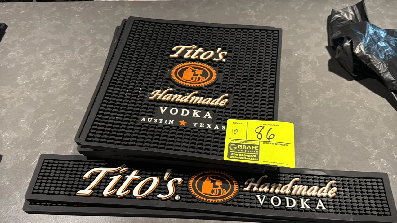 Tito's Handmade Vodka assorted rubber bar mats. Features molded black rubber construction with pronged surface for drainage and spill containment. Inc