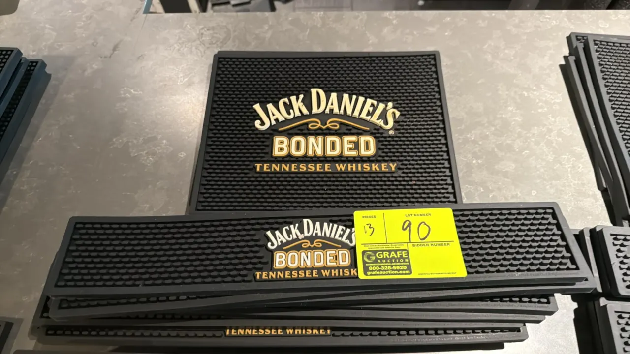 Assorted Jack Daniel's rubber bar mats. Features molded black rubber construction with pronged drainage surface and embossed Jack Daniel's Bonded Tenn