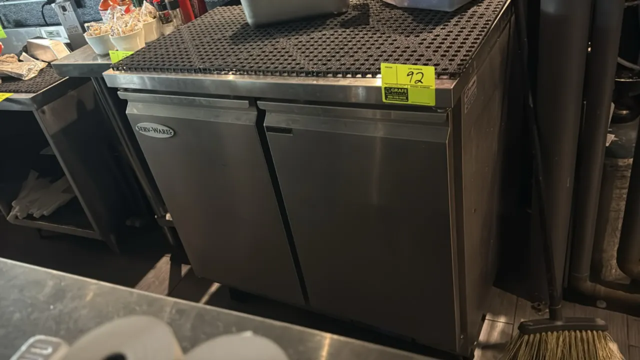 Serv-Ware UCR-36-HC undercounter commercial refrigerator. Features stainless steel construction, flat worktop, 2 solid swing doors, and wire shelving.