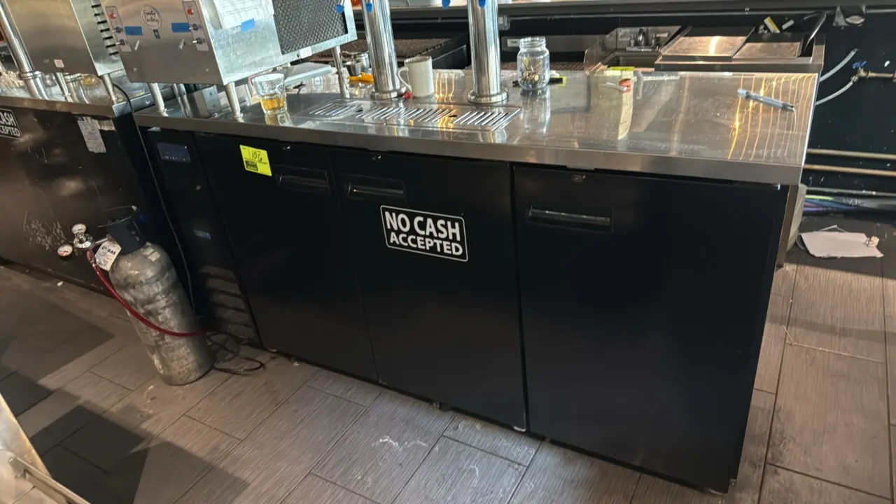 Arctic Air ADD72RZ-2 self-contained 3-door keg cooler. Features a stainless steel top, built-in drip tray, two draft beer towers, and black exterior f