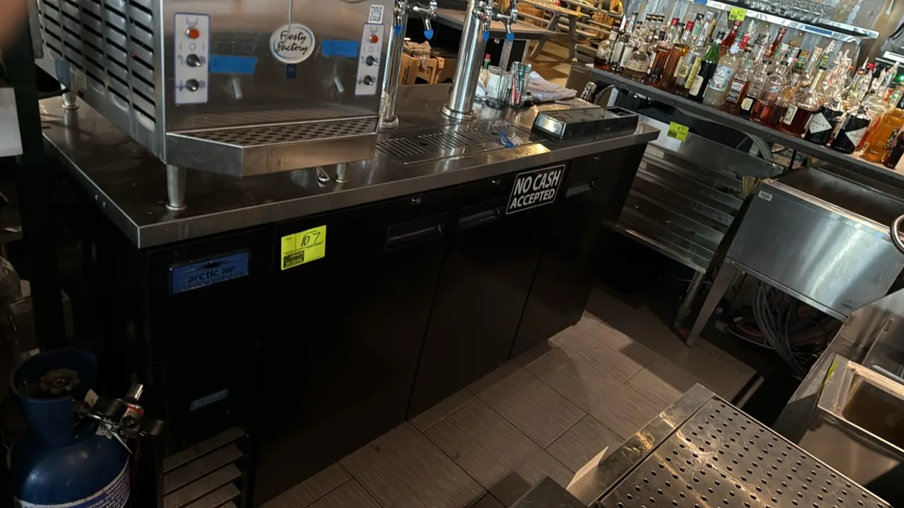 Arctic Air ADD72RZ-2 self-contained 3-door keg cooler. Features stainless steel worktop with surface drip tray, two draft beer towers with tap faucets