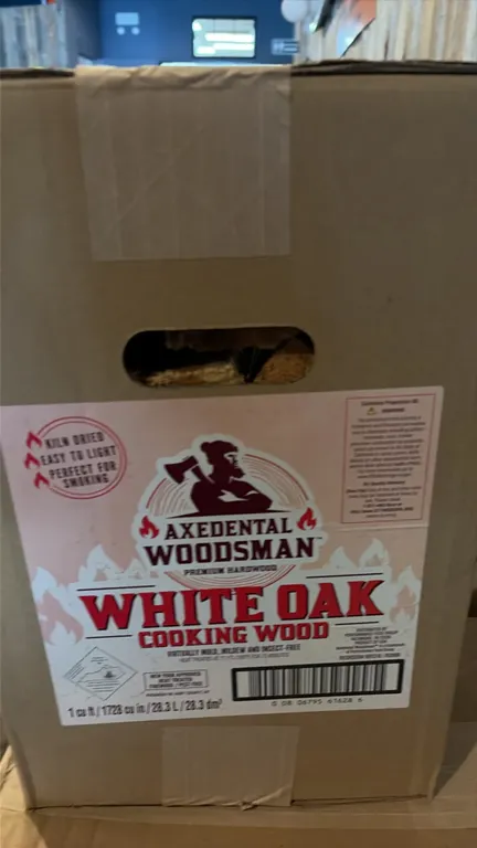 Axedental Woodsman white oak cooking wood. Kiln-dried split hardwood suitable for smoking and cooking. Includes boxed packages (1 cu ft each) and mesh