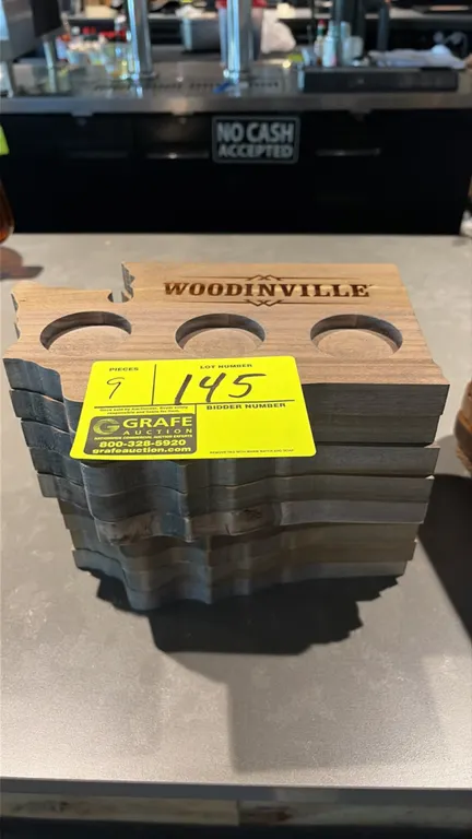 Woodinville 3-slot whiskey flight boards. Features solid wood construction cut in the shape of Washington State, engraved Woodinville branding, and th