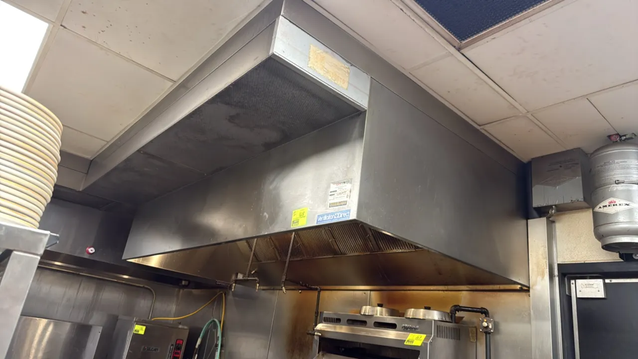 Ventilation Direct stainless steel exhaust hood. Features baffle grease filters, integrated lighting, and Amerex fire suppression system with tank, pi