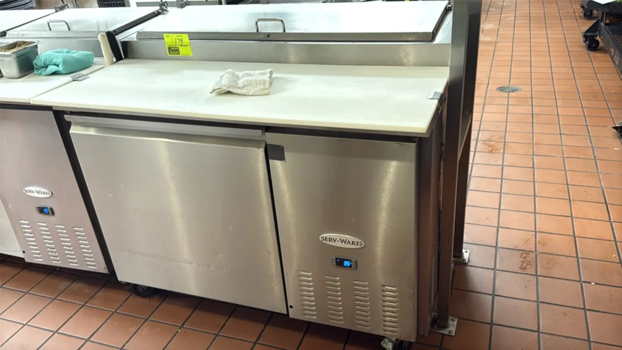 Serv-Ware PP44-6-HC self-contained refrigerated prep cooler. Features stainless steel construction with (1) solid door, top pan compartment with hinge