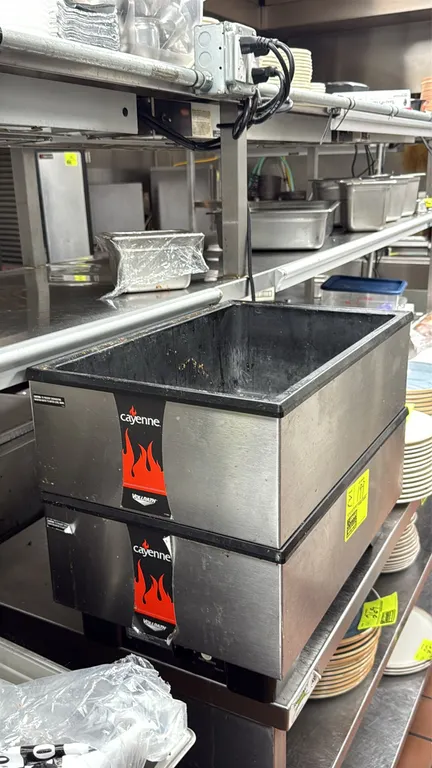Vollrath Cayenne countertop food warmers. Features stainless steel exterior casing and interior wells marked for use with water. Countertop design.