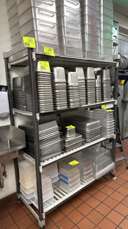 4-tier vented shelving rack. Features composite posts with removable slotted polymer shelf plates. 53" x 23" x 72". Contents not included.