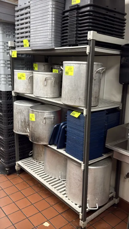 4-tier vented shelving rack. Features composite posts and removable vented plastic shelf plates. 53" x 23" x 72". Contents not included.