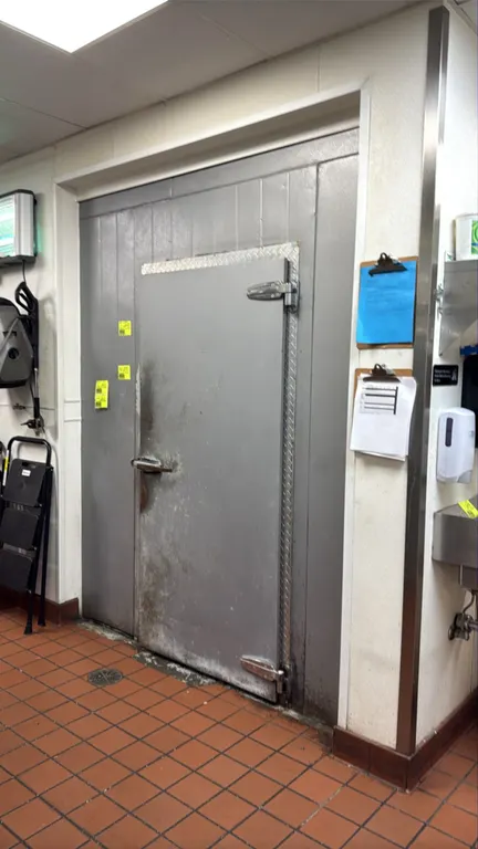 2-room walk-in cooler and freezer combo unit. Features foam insulated panels, walk-in doors, interior lighting, and evaporator coils. Cooler section m