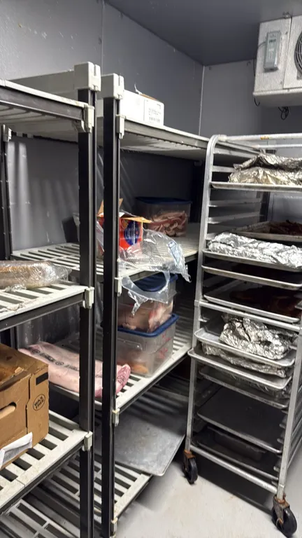 Walk-in cooler vented plastic shelving units. Features 5-tier composite construction with removable slotted shelf plates and composite upright posts.