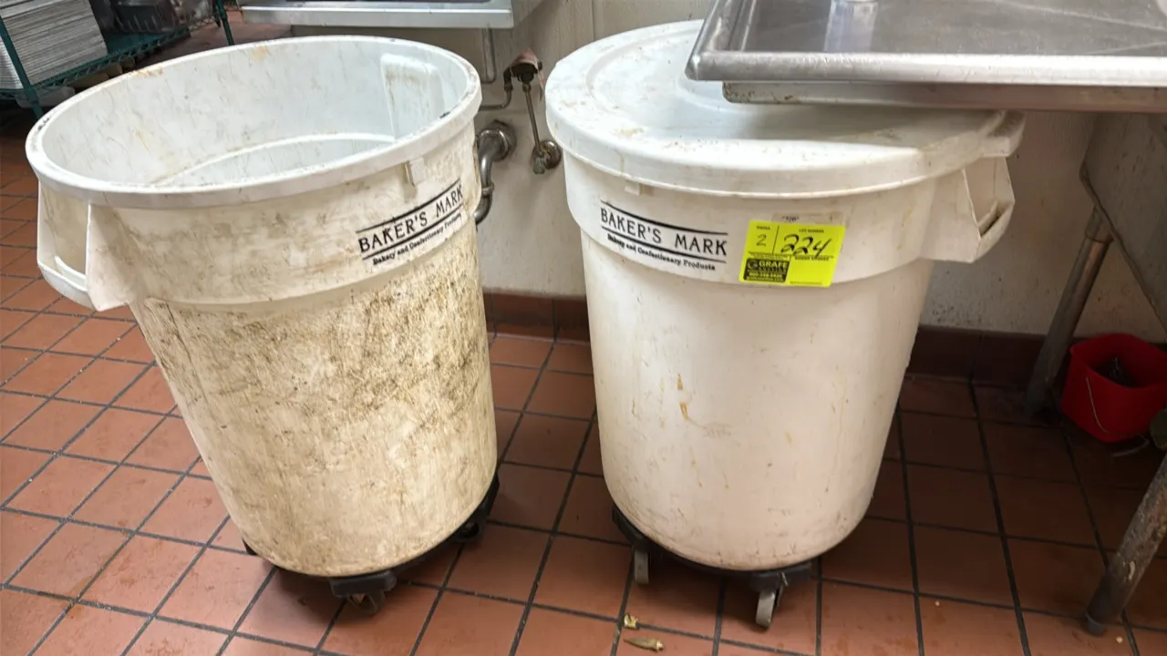Baker's Mark white polyethylene rolling utility cans. Features integrated side handles, twist-on caster dollies, and includes two lids.
