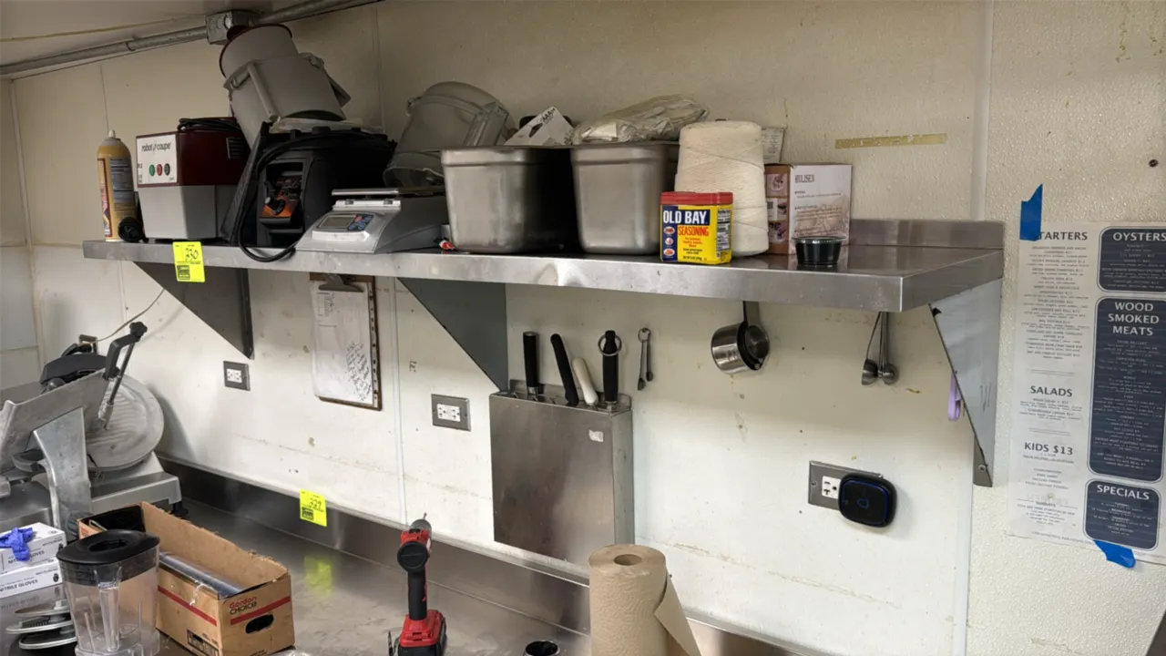 Stainless steel wall-mount shelf. Features integrated rear backsplash and support brackets. 72" x 15". Contents not included.