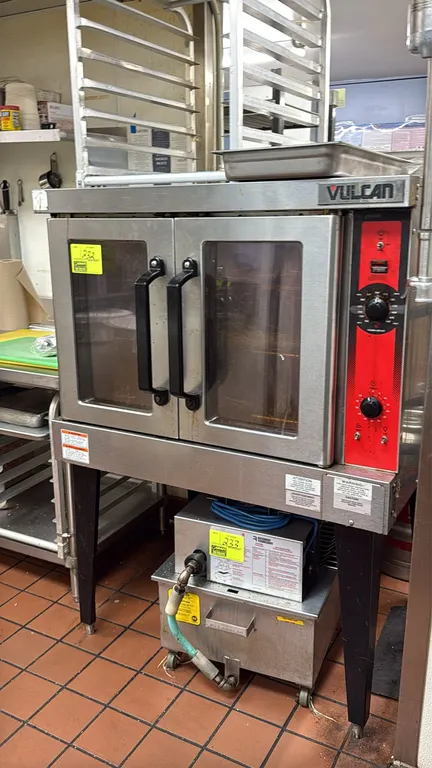 Vulcan electric convection oven. Features stainless steel exterior, double doors with glass windows, interior wire racks, analog thermostat control up