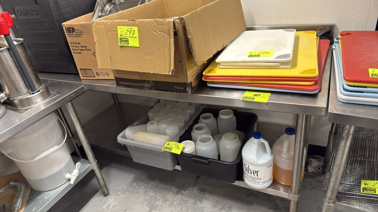 Stainless steel work table. Features a backsplash and undershelf. 72"L x 30"W. Mounted on tubular legs with adjustable bullet feet. Contents not inclu