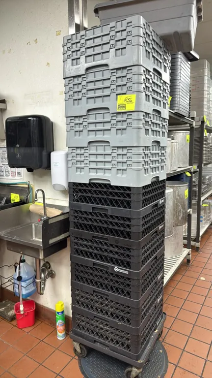 Poly wash racks. Constructed of heavy-duty molded plastic in stackable designs, featuring four gray and six black racks with slotted and lattice walls