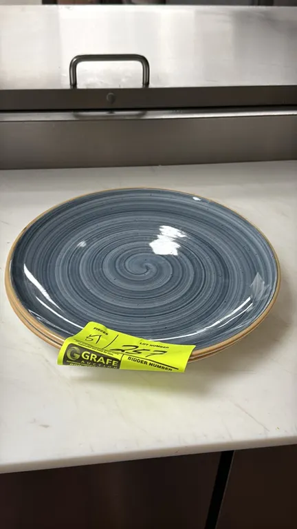 Bonna porcelain plates. Lot includes (51) hand-painted plates featuring a blue swirl pattern and tan rim. Made in Turkey. 10.5"Dia.