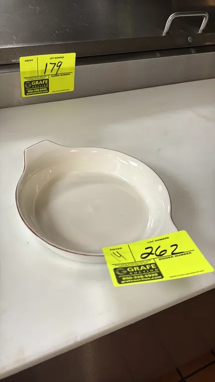 Bonna porcelain bowls. Includes (14) bowls featuring white porcelain construction, dual tab handles, and brown rim accent. 8".