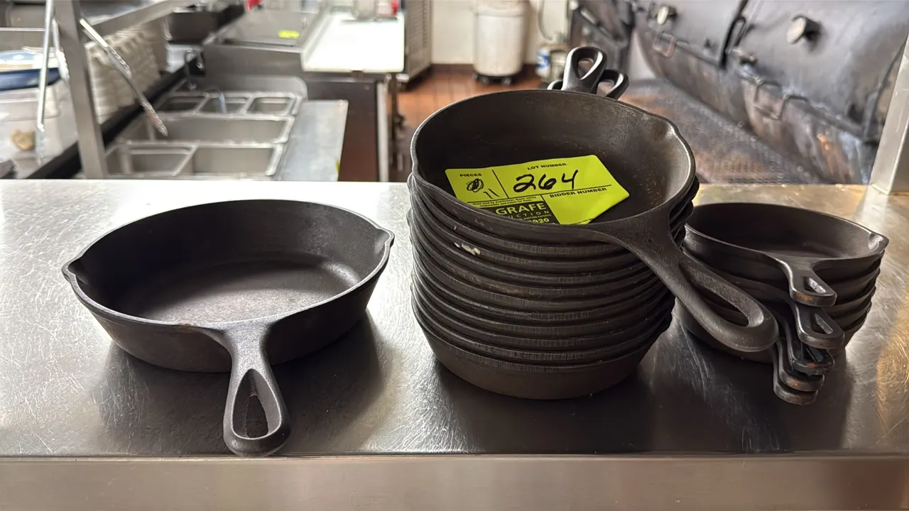 Cast iron skillets. Features assorted small sizes with dual pour spouts and integral teardrop hanging hole handles.
