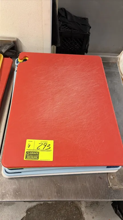 San Jamar poly cutting boards. Features polyethylene construction with non-slip corner grips and integrated hanging hook. 18" x 24". Includes (6) cutt