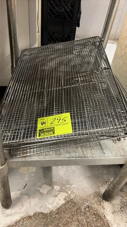 Stainless steel wire drying racks. Features wire mesh grid construction with integrated support risers. Stainless steel table not included.