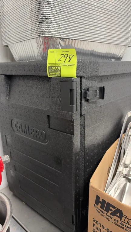 Cambro insulated food pan carrier. Features black expanded foam construction with a front-loading latched door. Includes assorted disposable aluminum