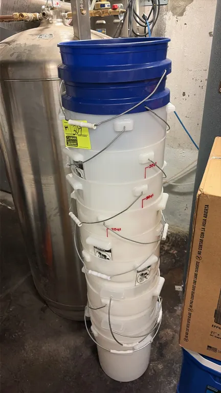 Plastic buckets. Includes semi-translucent 20-quart buckets featuring wire bail handles with plastic grips, side assist handles, and measurement marki