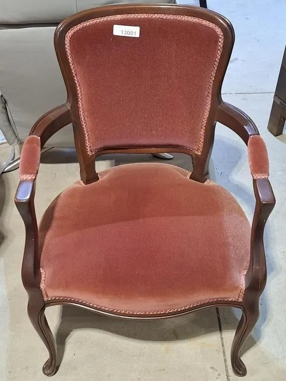Lovely cabriolet armchair featuring a dark wood
