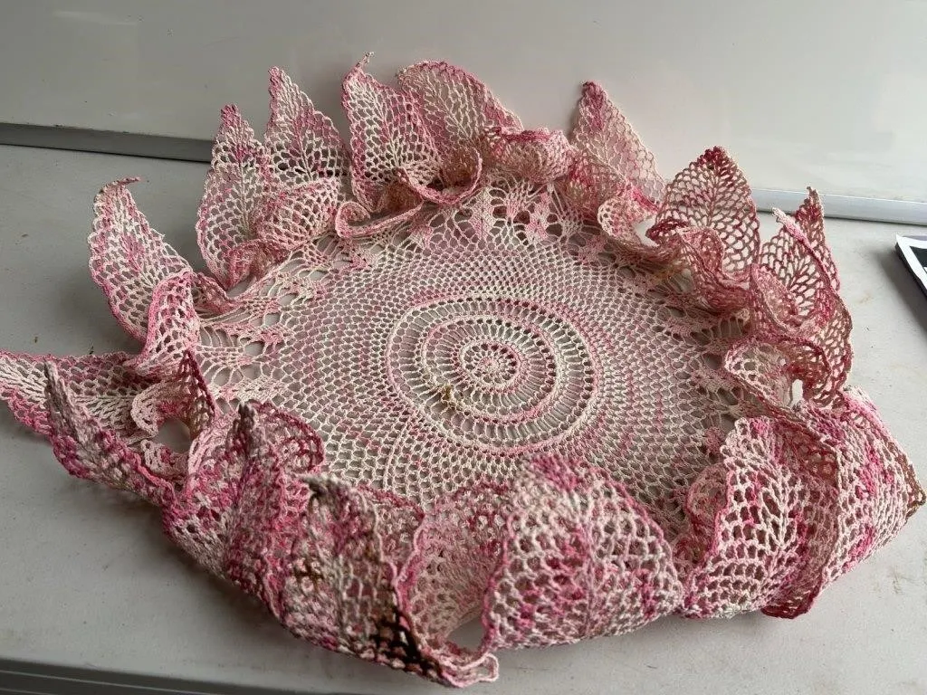 Pink & white crocheted lace doily with leaf edge
