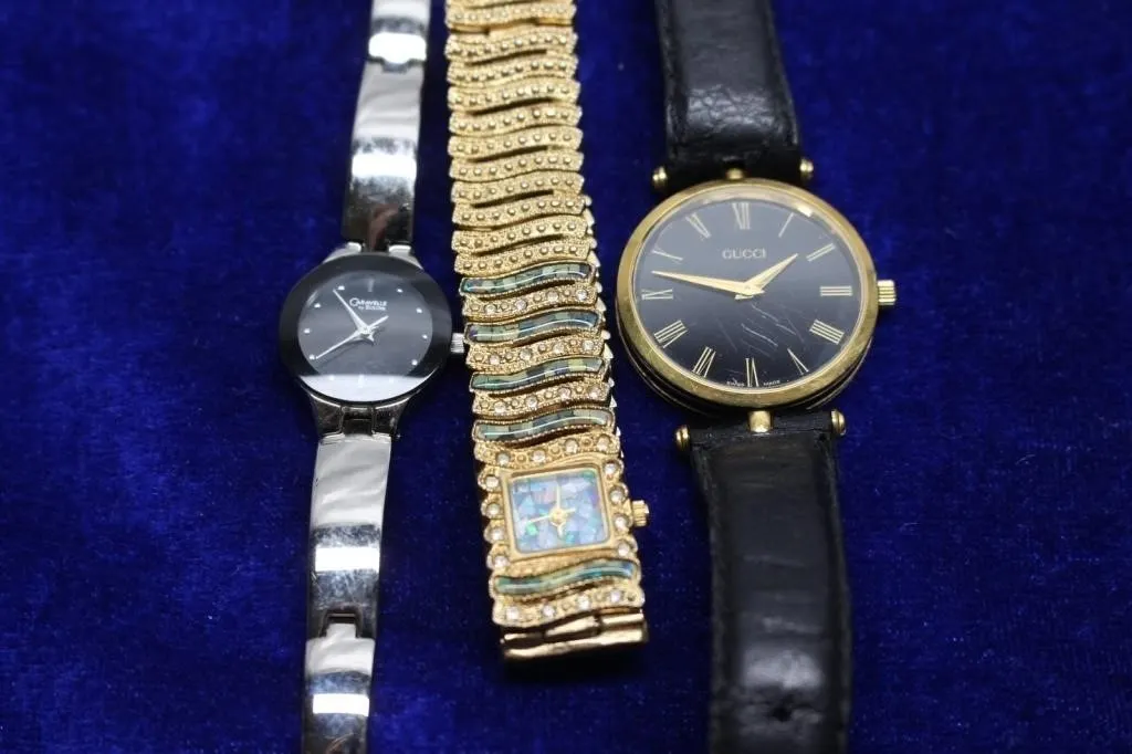 Three ladies' wristwatches: Caravelle, Gucci,