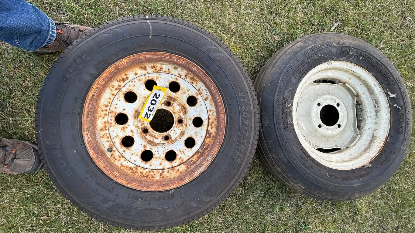 205/75R15 ROAD RIDER ON 5 BOLT RIM & 6.70-15 IMPLEMENT TIRE ON 4 BOLT RIM
