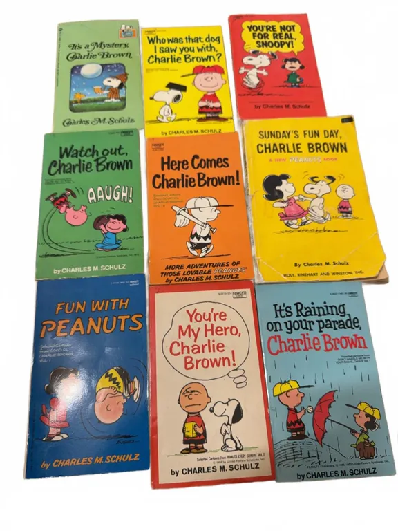 8 Charles M. Schulz Peanuts Paperback Books Featuring Charlie Brown