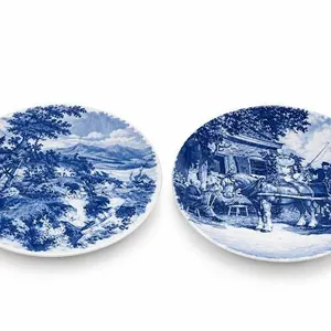 Two Blue and White Decorative Plates and Two Clear Glass Serving Platters