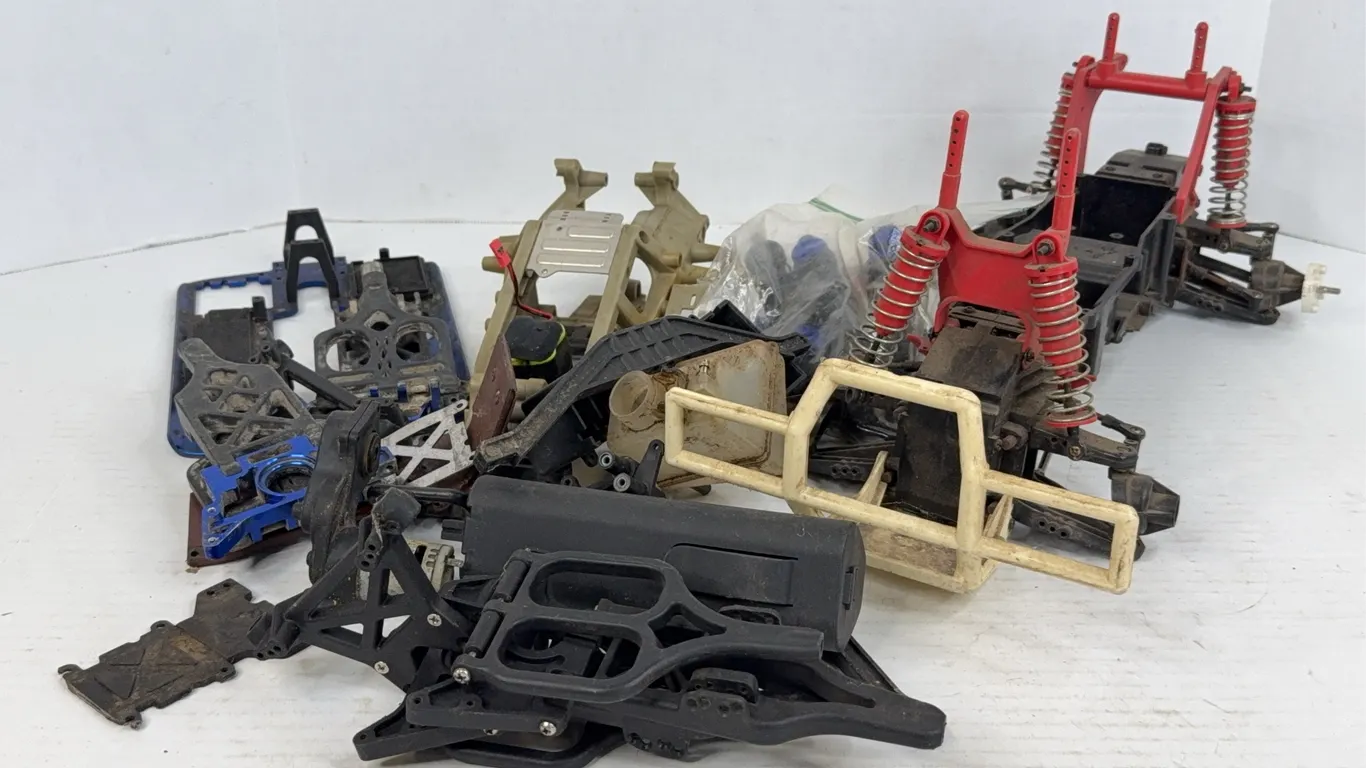 Assorted RC Car Chassis Parts Suspension Components And Fuel Line Spool