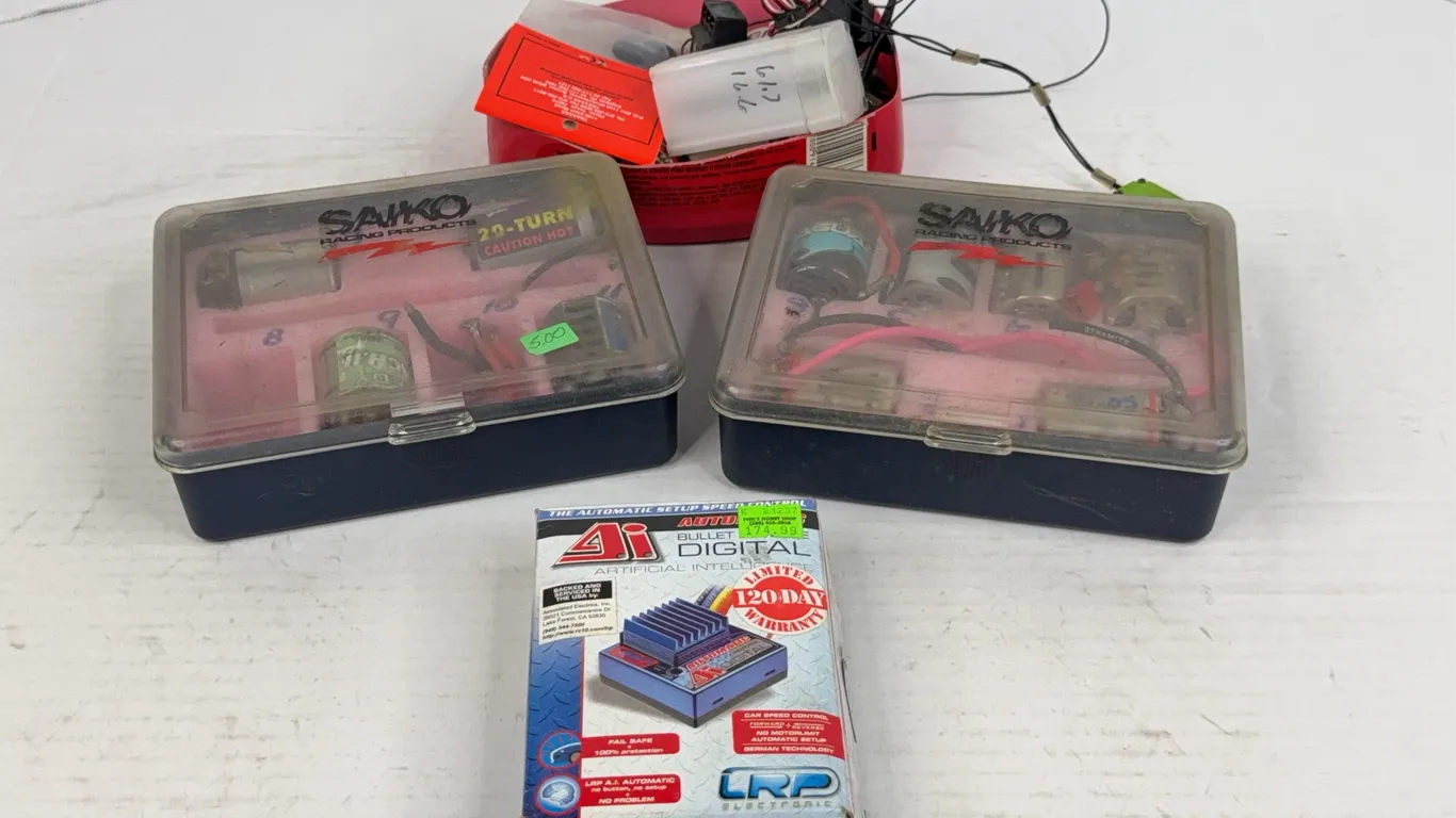 RC Car Parts Lot Featuring Electric Motors and LRP Speed Control