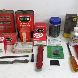 Automotive Tire Repair Lot Featuring Tech Cement Patches and Hand Tools