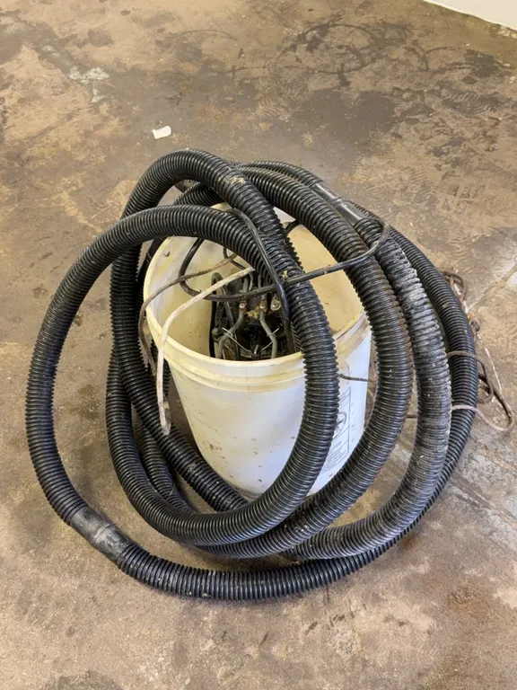 Submersible Sump Pump with Corrugated Discharge Hose and Bucket