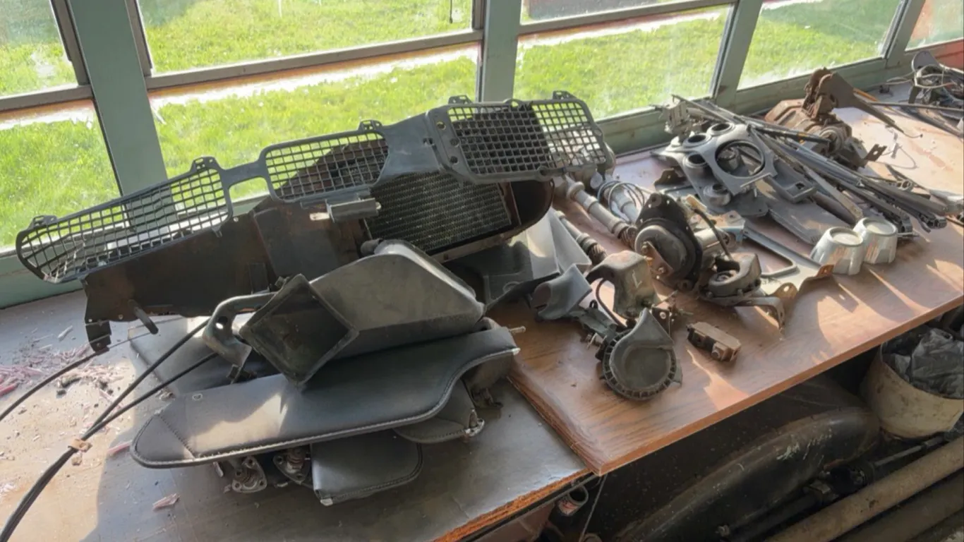 Assorted Automotive Components Featuring Accel Distributors and Oldsmobile Center Caps