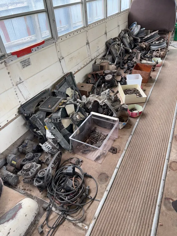 Assorted Automotive Parts Lot with Alternators Radiators and Steel Wheels